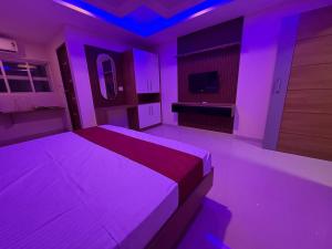 En eller flere senge i et værelse på Spectra Health & Suite