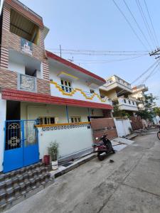 a motorcycle parked in front of a house at Villa Bonny Home Stay in Puducherry