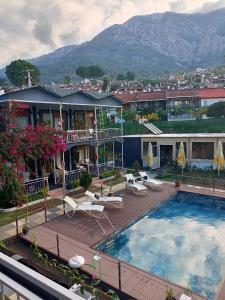 a view of a hotel with a swimming pool at Fİi SUİTES in Kumluca