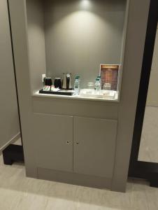 a kitchen with white cabinets and a counter top at الفرسان للشقق المخدومه in Al Kharj +23 photos
