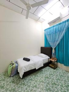 Giường trong phòng chung tại Mumtaz Beach Homestay 2