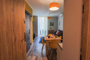 a living room with a table and a dining room at Ospitaria-Suite Sant'Anastasia in Verona +10 photos