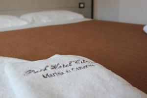 a towel with the words are afraid of a water sterilizer istg at Park Hotel Cilento in Marina di Camerota
