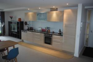 A kitchen or kitchenette at The Sands