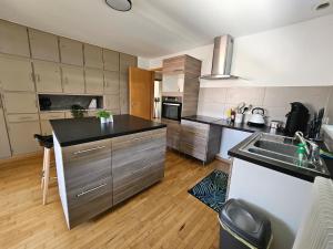 a kitchen with a sink and a counter top at Welcome to Angèle 'Homes 2 in Niederbronn-les-Bains