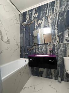 Et badeværelse på Nexpo Premium apartaments