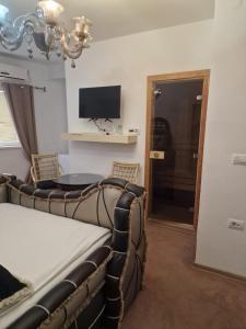 Et tv og/eller underholdning på Faraon apartmani Bg + 7 billeder