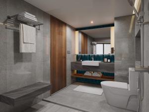 Et badeværelse på Le Meridien Phuket Beach Resort