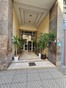 a hallway with potted plants in a building at Casablanca City-Centre Apartment in Casablanca