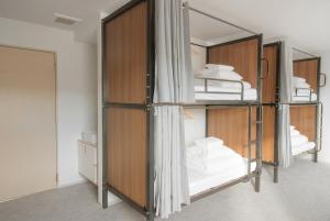 a group of bunk beds in a room at The GAKUSUI in Hakuba