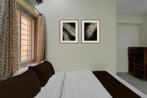 En eller flere senge i et værelse på Hotel O The Dream Inn