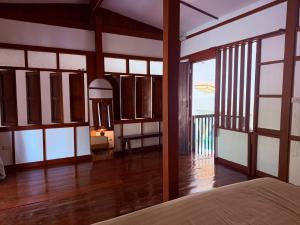 En eller flere senge i et værelse på Private Garden Home Koh Phangan