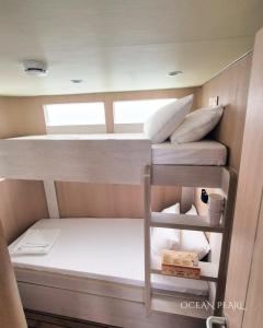 a couple of bunk beds in a boat at Ocean Pearl in Filitheyo