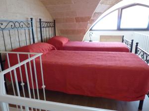 A bed or beds in a room at Casa Gianni
