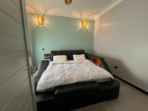 En eller flere senge i et værelse på Dim de Lights Jinja