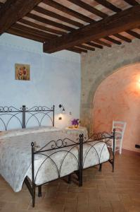 a bedroom with a bed and a table in it at Bellavista in Seggiano +104 photos