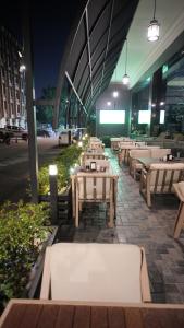 a row of tables in a restaurant at night at Al jadriya Palace in Baghdad