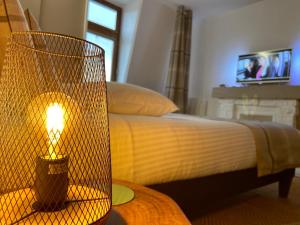 TV a/nebo společenská místnost v ubytování Centre historique Dijon "Le Charmant" et "Le Charmant Bis"