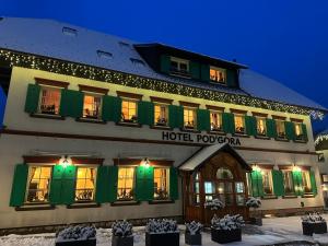a hotel poznan in the snow at night at Pod Gora Boutique Hotel in Kranjska Gora
