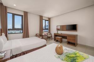 TV a/nebo společenská místnost v ubytování Lumina Hotel & Apartment