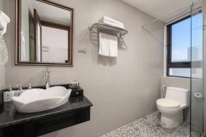 Koupelna v ubytování Lumina Hotel & Apartment