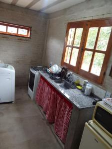 Kuchyň nebo kuchyňský kout v ubytování Kitnet in São Gonçalo do Rio das Pedras, Serro-MG