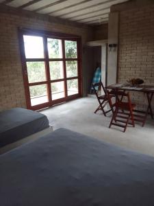 Postel nebo postele na pokoji v ubytování Kitnet in São Gonçalo do Rio das Pedras, Serro-MG