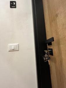 a black door with a lock on it at La Terrazza in centro in Marsala +70 photos