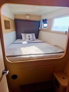 a small bed in the back of an rv at catamaran yatch tour in Göcek