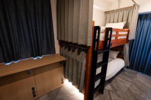 a bedroom with two bunk beds and a window at Wa Hostel in Tokyo +29 photos