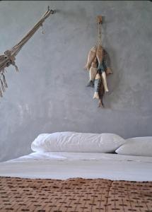 En eller flere senge i et værelse på Pousada barra golden