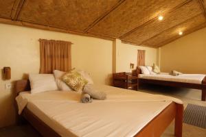 En eller flere senge i et værelse på Cocovana Beach Resort + 114 billeder