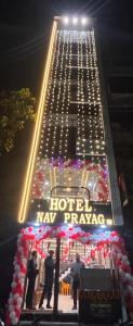 a large building with people standing in front of it at Hotel Nav Prayag Inn in Prayagraj