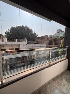 a window on a building with a view of a city at Hotel Nav Prayag Inn in Prayagraj
