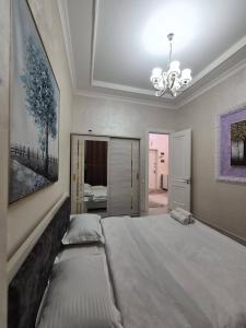 En eller flere senge i et værelse på Toshkent siti