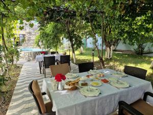 a table with plates of food on top at Firuze Hotel & Restaurant in Sheki