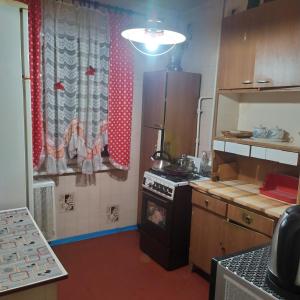 Køkken eller tekøkken på Східний мікрорайон апартаменти