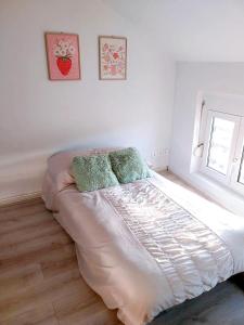 En eller flere senge i et værelse på Bulles de bonheur