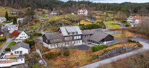 an aerial view of a house on a hill at Siggjo Guesthouse Bømlo and Stord in Mosterhamn