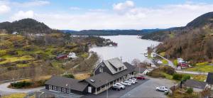 an aerial view of a town with a lake at Siggjo Guesthouse Bømlo and Stord in Mosterhamn