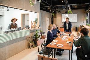 a group of people sitting at a table in a restaurant at 富士Base御殿場 Station-Side in Gotemba