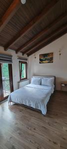a bedroom with a bed with a cross on the wall at MyHomeSapanca in Sapanca +21 photos