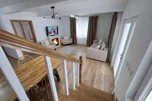 an overhead view of a living room with a staircase at Liziera Cabin Malaia in Malaia