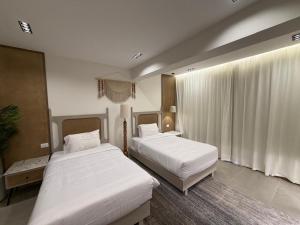 En eller flere senge i et værelse på Sunny Days Palma De Mirette Resort & Spa