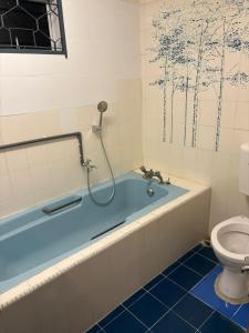 Et badeværelse på 786 Bali Top Homestay + 18 billeder