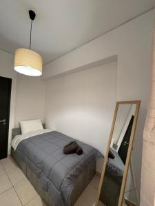 En eller flere senge i et værelse på Cleo Luxury Suites