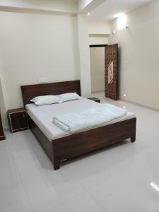 a bedroom with a large bed in a room at Hotel Krishn Residency in Garwa Road