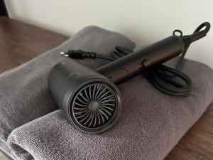 a hair dryer sitting on top of a table at Cozy Relax & Calm in Koh Phangan