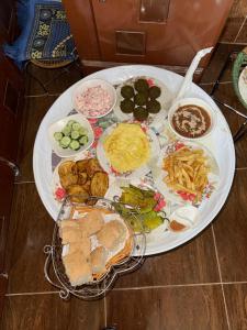 a large white plate of food on a table at MERIT Guest House in Aswan