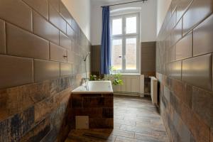 a bathroom with a sink and a window at Casa Balcescu in Braşov +112 photos